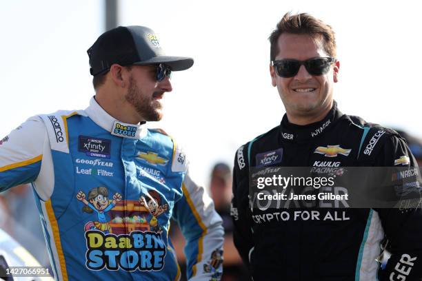 Daniel Hemric, driver of the DaaBIN Store Chevrolet, and Landon Cassill, driver of the USIO Chevrolet, talk on the grid during practice for the...