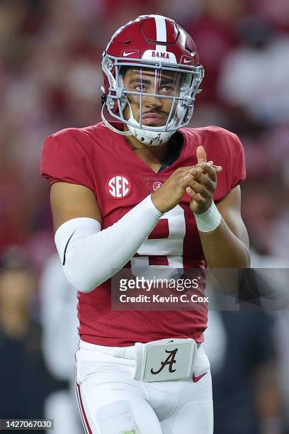 Bryce Young of the Alabama Crimson Tide celebrates after Jase McClellan scored a touchdown against the Vanderbilt Commodores during the second half...