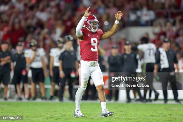 Bryce Young of the Alabama Crimson Tide celebrates after Jase McClellan scored a touchdown against the Vanderbilt Commodores during the second half...