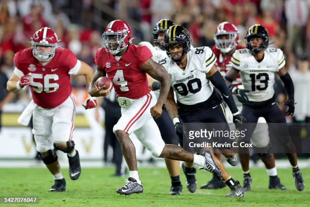 Jalen Milroe of the Alabama Crimson Tide runs the ball for a touchdown against the Vanderbilt Commodores during the second half of the game at...