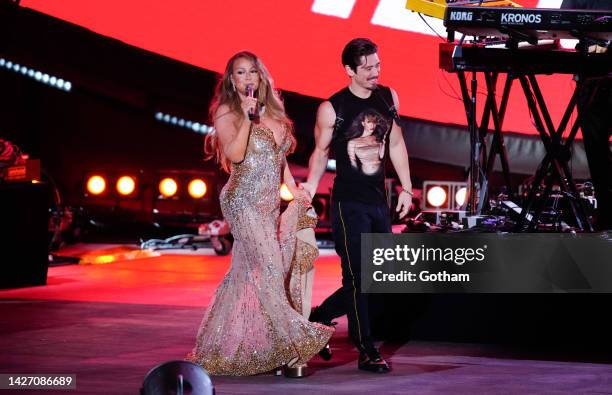 Mariah Carey, escorted by Bryan Tanaka, performs during the 2022 Global Citizen Festival in Central Park on September 24, 2022 in New York City.