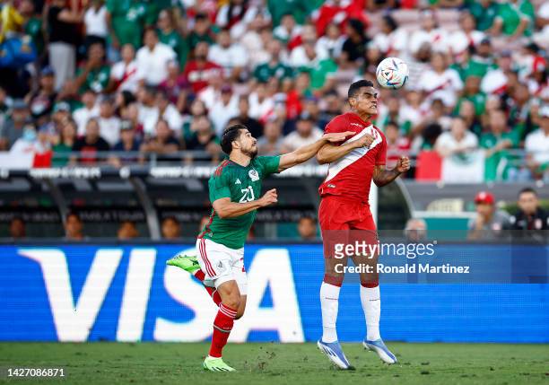 Anderson Santamaria of Peru controls the ball against Henry Martin of Mexico in the first half at Rose Bowl Stadium on September 24, 2022 in...