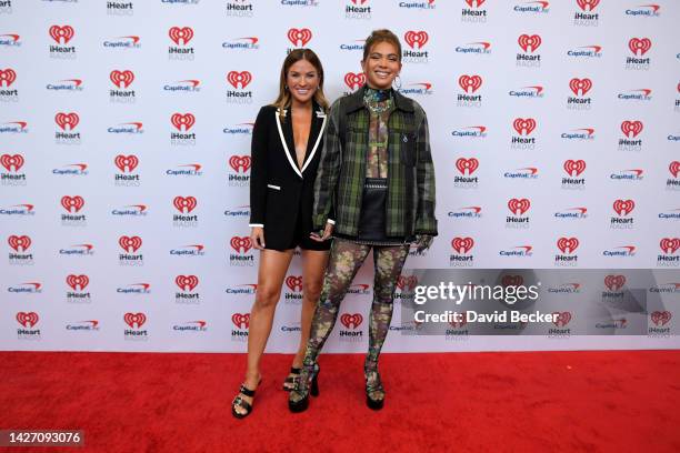 Becca Tilley and Hayley Kiyoko arrive at the 2022 iHeartRadio Music Festival at T-Mobile Arena on September 24, 2022 in Las Vegas, Nevada.