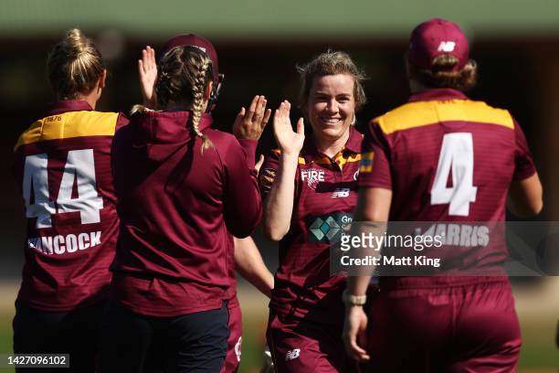 Georgia Redmayne of Queensland celebrates victory with team mates after the WNCL match between New South Wales and Queensland at North Sydney Oval,...
