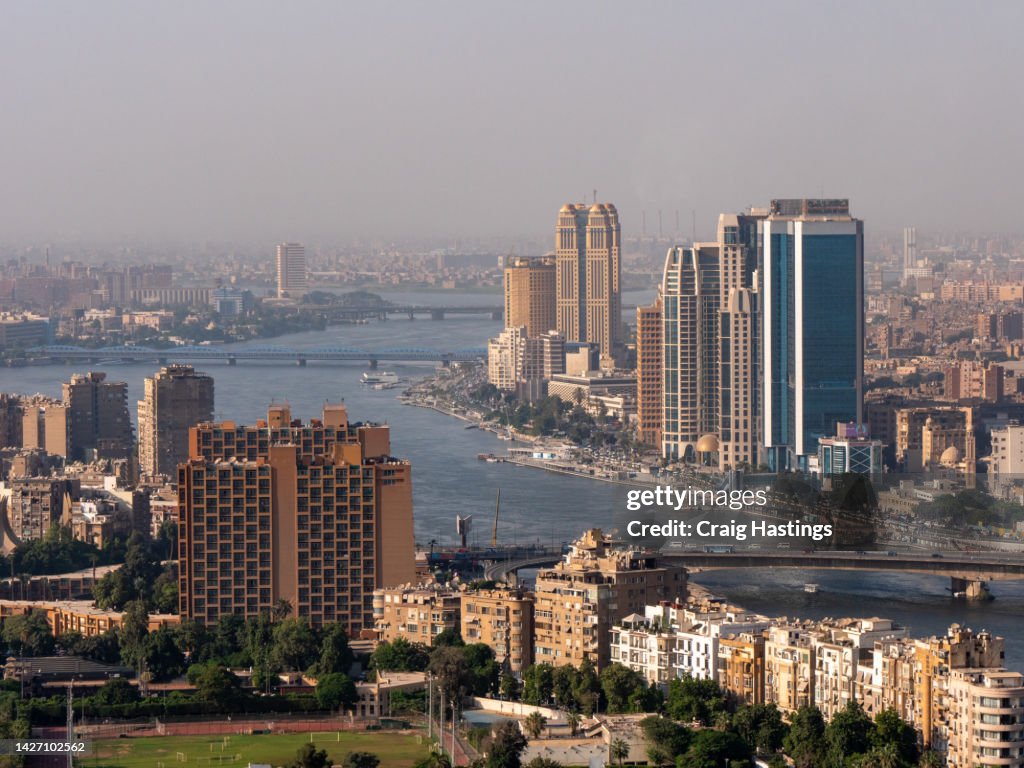 High Angle view of Downtown Cairo during rush hour at 6 October Bridge with cars in traffic jams on highways as commuters try to get home after work.
