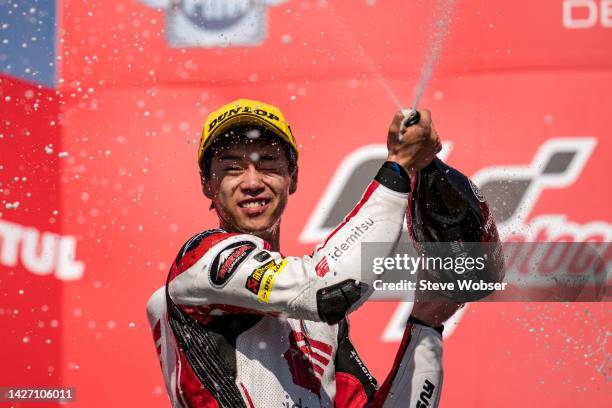 Moto2 rider Ai Ogura of Japan and Idemitsu Honda Team Asia celebrates his win with Prosecco during the race of the MotoGP Motul Grand Prix of Japan...