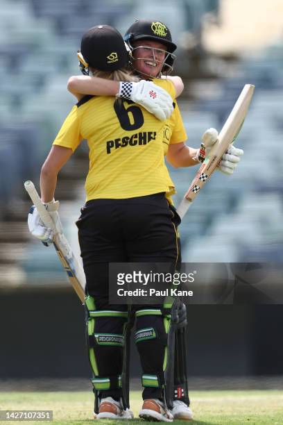 Beth Mooney of Western Australia celebrates her 150 with Taneale Peschel during the WNCL match between Western Australia and Australian Capital...