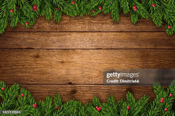 christmas and new year background with fir branches and red berries on rustic wooden planks - plants wood furniture vector stock illustrations