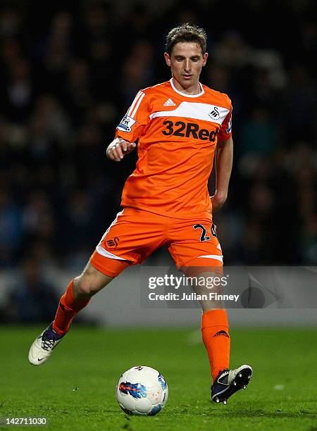 Joe Allen of Swansea City with the ball during the Barclays Premier League match between Queens Park Rangers and Swansea City at Loftus Road on April...