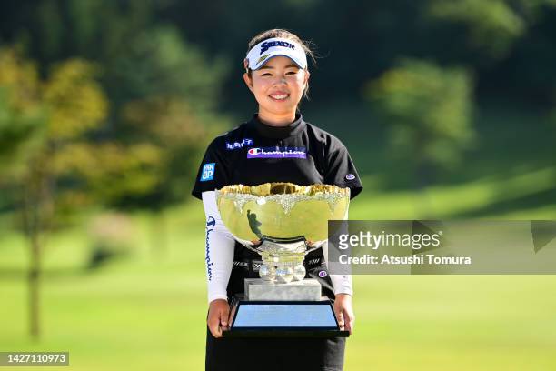 Miyuu Yamashita of Japan poses with the trophy after winning the tournament following the final round of Miyagi TV Cup Dunlop Ladies Open at Rifu...