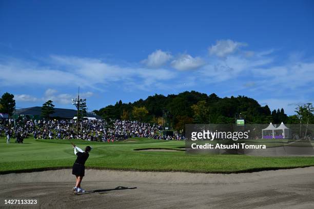 Miyuu Yamashita of Japan hits her second shot out from a bunker on the 18th hole during the final round of Miyagi TV Cup Dunlop Ladies Open at Rifu...