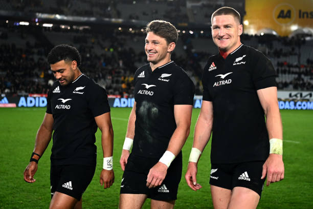 AUCKLAND, NEW ZEALAND - SEPTEMBER 24: Richie Mo’unga, Beauden Barrett and Jordie Barrett of the All Blacks celebrate after winning The Rugby Championship and Bledisloe Cup match between the New Zealand All Blacks and the Australia Wallabies at Eden Park on September 24, 2022 in Auckland, New Zealand. (Photo by Hannah Peters/Getty Images)