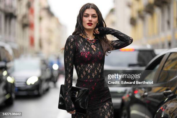 https://media.gettyimages.com/id/1427138642/photo/milan-italy-zoia-mossour-wears-gold-earrings-a-blue-red-gold-large-stones-pendant-necklace-a.jpg?s=612x612&w=gi&k=20&c=uzswCiy3THRFFImpsuG61CEP7apC5FyLpjNfXcWsqKo=