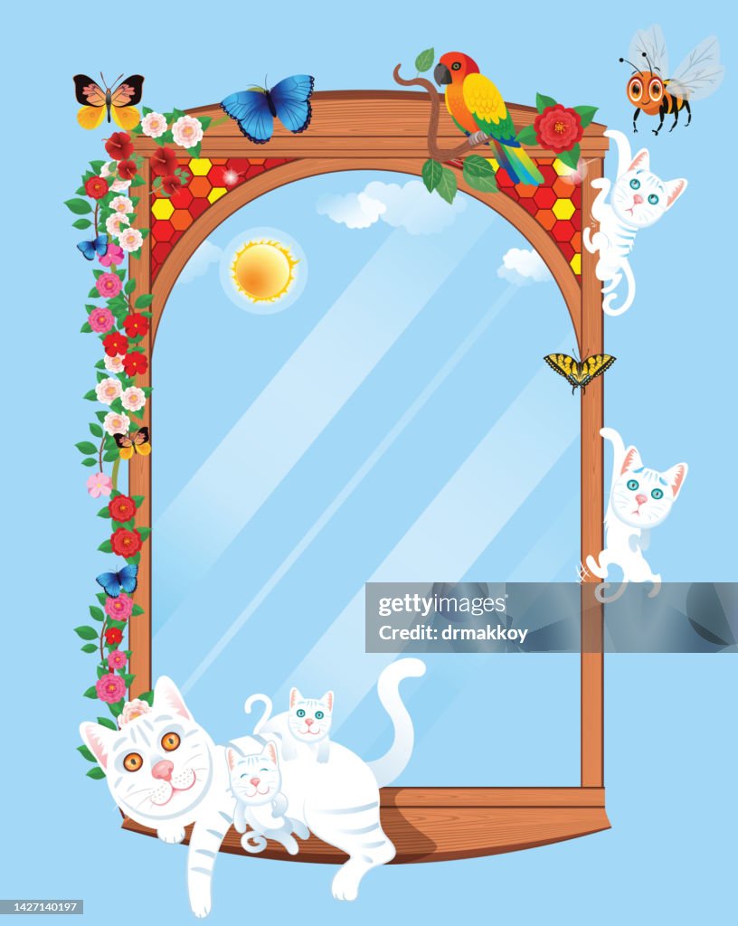 White cat and kittens sleeping on the wooden window