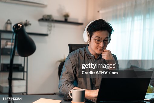 Developer Computer programmer man working Coding on laptop computer at home office. Working remotely from home Developer Computer programmer man working Coding on laptop computer at home office. Working remotely from home