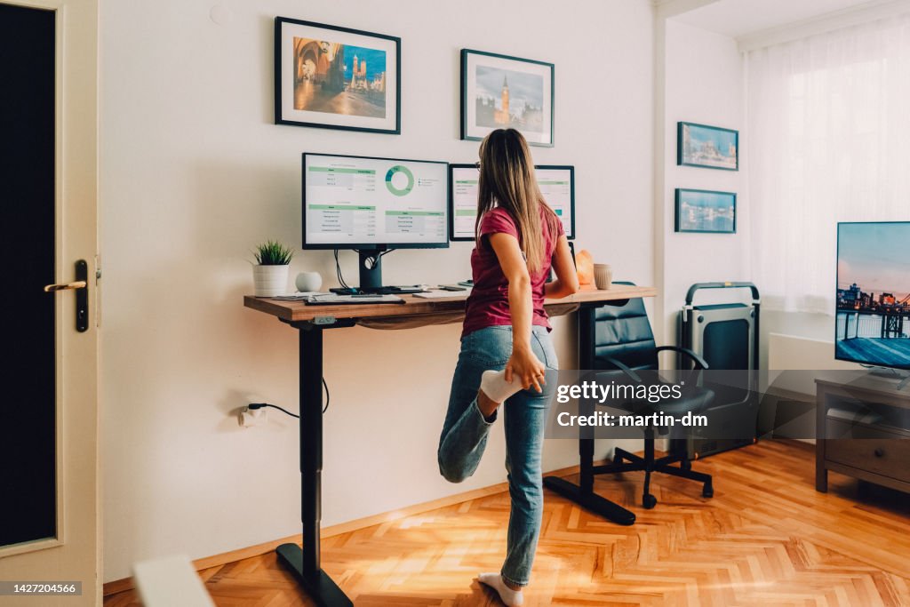 Young woman working at standing desk