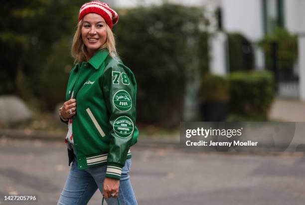 Yasmin von Schlieffen-Nannen seen wearing Golden Goose green oversized bomber jacket, Frame blue wide leg jeans, Yves Saint Laurent colorful polkadot...