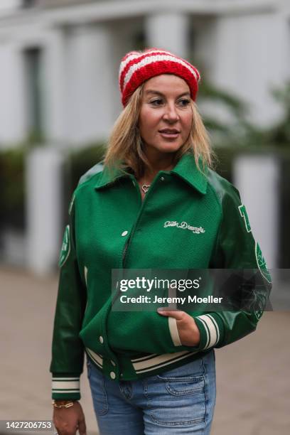 Yasmin von Schlieffen-Nannen seen wearing Golden Goose green oversized bomber jacket, Frame blue wide leg jeans, Yves Saint Laurent colorful polkadot...