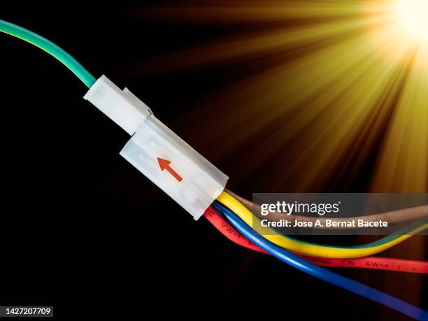 electrical connection of electricity cables on a black background. - cable installer stock pictures, royalty-free photos & images