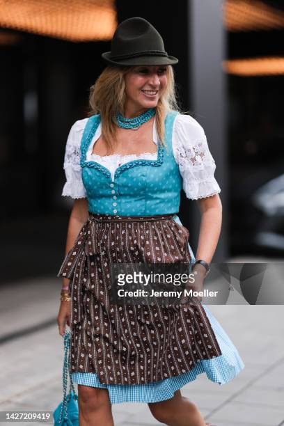 Yasmin von Schlieffen-Nannen is seen wearing blue/white Lodenfrey Dirndl short dress, brown Lodenfrey hat, blue necklace from Brahmfeld Gutruf, on...