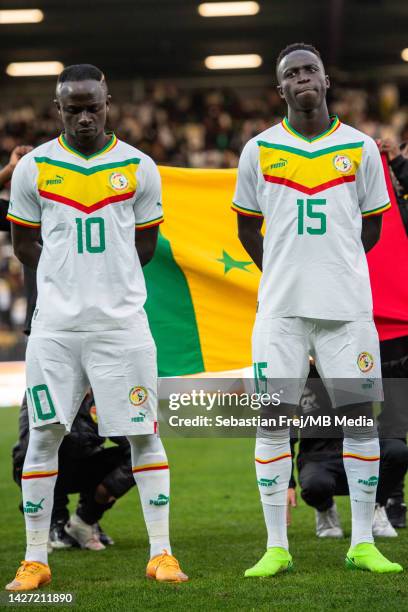 Sadio Mane and Krepin Diatta of Senegal look on as the national anthems are played during the international friendly match between Senegal and...