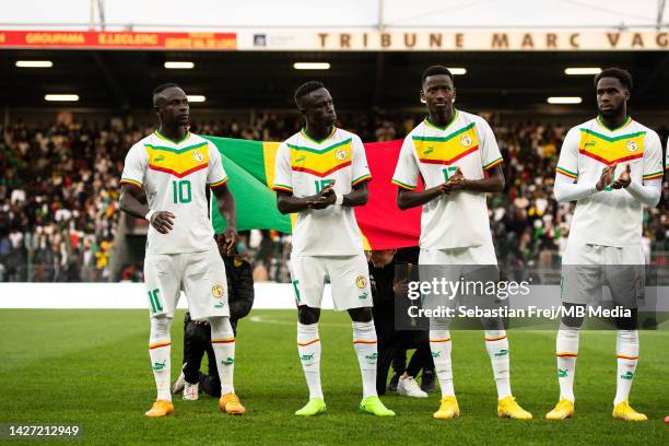 Sadio Mane, Krepin Diatta, Pape Matar Sarr and Boulaye Dia of Senegal look on as the national anthems are played during the international friendly...