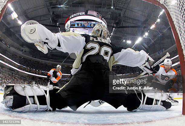 Marc-Andre Fleury of the Pittsburgh Penguins makes a save on Scott Hartnell of the Philadelphia Flyers in Game One of the Eastern Conference...