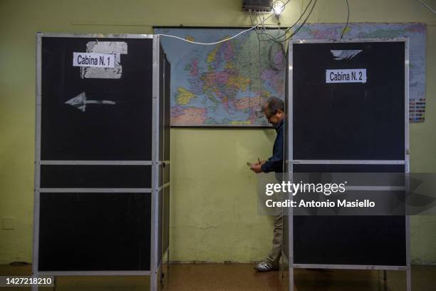 Man leaves the voting booth to cast his vote in the Italian general election on September 25, 2022 in Rome, Italy. The snap election was triggered by...