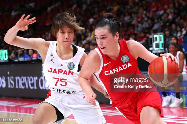 Bridget Carleton of Canada drives past Nanako Todo of Japan during the 2022 FIBA Women's Basketball World Cup Group B match between Japan and Canada...