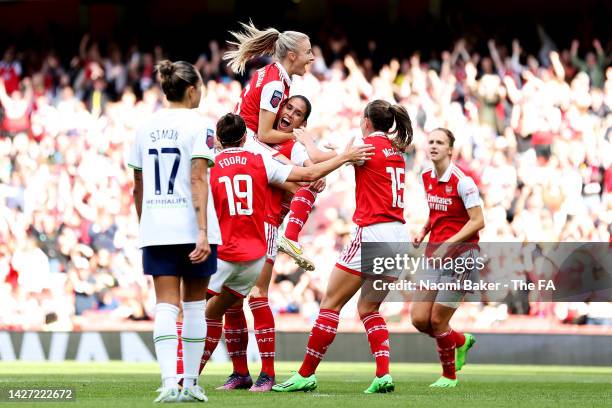 Rafaelle Souza of Arsenal celebrates scoring their team's third goal with teammates during the FA Women's Super League match between Arsenal and...