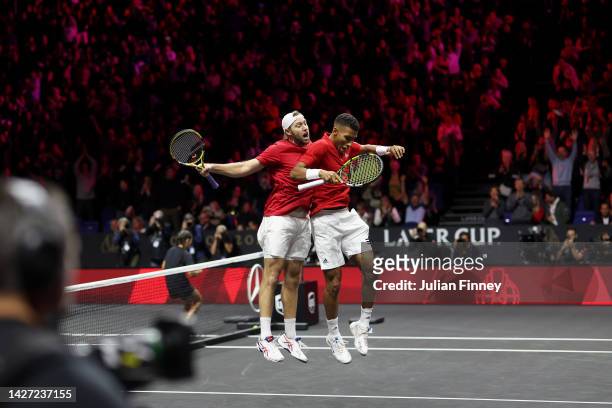 Jack Sock and Felix Auger-Aliassime of Team World celebrate match point during the match between Matteo Berrettini and Andy Murray of Team Europe and...