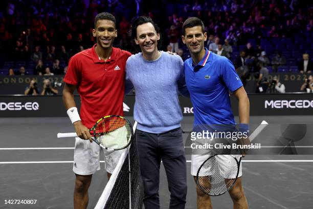 Felix Auger-Aliassime of Team World, Tom Hiddleston and Novak Djokovic of Team Europe pose for a photograph during Day Three of the Laver Cup at The...