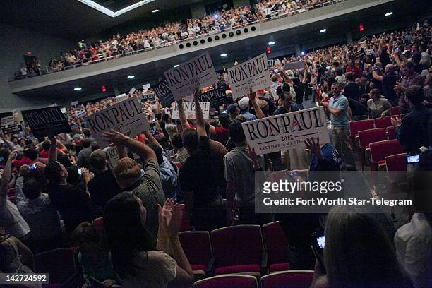 Supporters cheer in anticipation of a town hall meeting featuring United States Rep. Ron Paul at the Will Rodgers Memorial Center in Fort Worth,...
