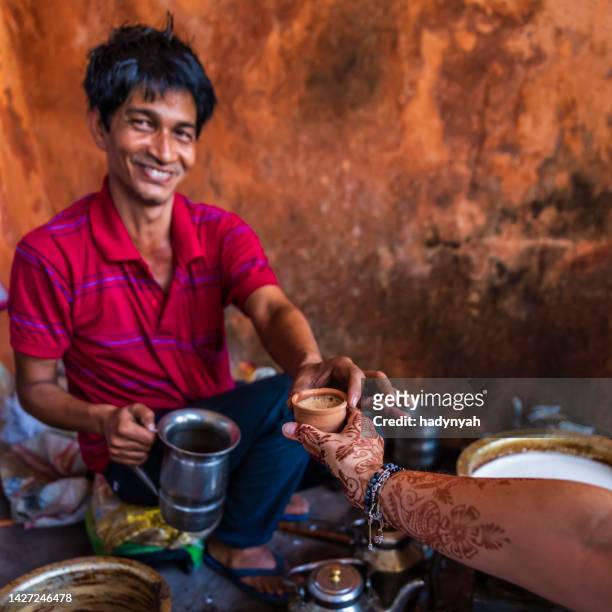 indian street seller selling tea - masala chai in jaipur - chai tea stock pictures, royalty-free photos & images