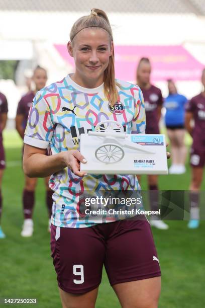 Ramona Maier of SGS Essen poses with the goalgetter tropy of kicker prior to the Flyeralarm Frauen-Bundesliga match between SGS Essen and SV Meppen...