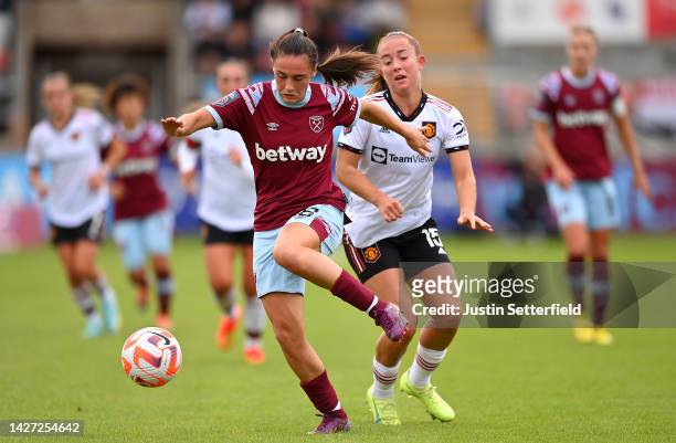Jessica Ziu of West Ham United is put under pressure by Maya Le Tissier of Manchester United United during the FA Women's Super League match between...