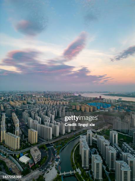 cityscape of hangzhou, china under the sunset from the perspective of drone - hangzhou stock pictures, royalty-free photos & images