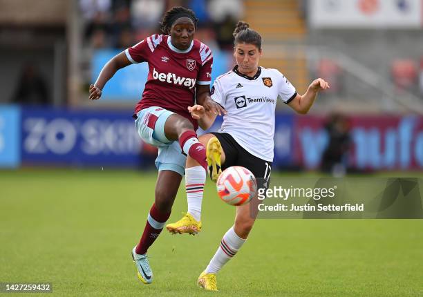 Hawa Cissoko of West Ham United battles for possession with Lucia Garcia of Manchester United during the FA Women's Super League match between West...