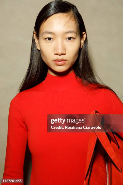 Luo Yi poses backstage at the Salvatore Ferragamo Fashion Show during the Milan Fashion Week Womenswear Spring/Summer 2023 on September 24, 2022 in...