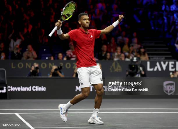 Felix Auger-Aliassime of Team World celebrates match point in the singles match between Felix Auger-Aliassime of Team World and Novak Djokovic of...