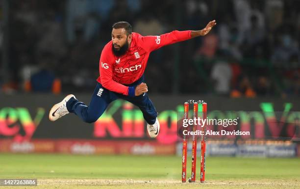 Adil Rashid of England takes flight as he slips in his action during the 4th IT20 between Pakistan and England at Karachi National Stadium on...