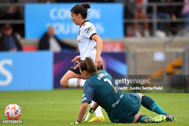 Lucia Garcia of Manchester United scores their team's first goal past Mackenzie Arnold of West Ham United during the FA Women's Super League match...