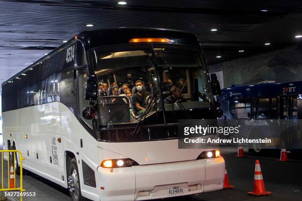 Buses of migrants who have been detained at the Texas border continue to arrive in New York, September 25, 2022 at the Port Authority bus terminal in...