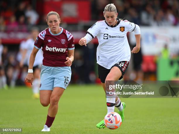 Alessia Russo of Manchester United runs with the ball while under pressure from wha15 during the FA Women's Super League match between West Ham...