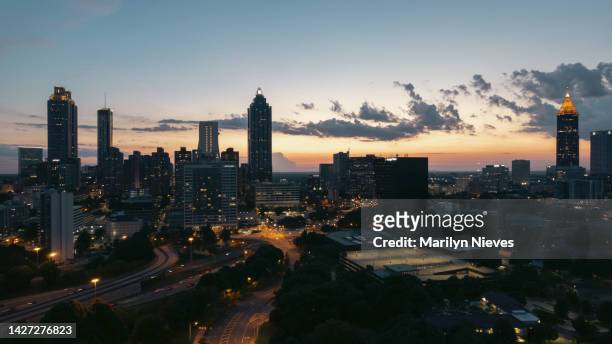 busy highways intersect in downtown atlanta at sunset - "marilyn nieves" stock pictures, royalty-free photos & images