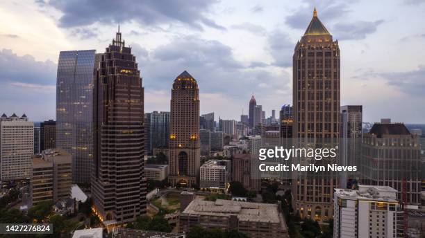 midtown atlanta and the towering buildings at sunset - midtown stock pictures, royalty-free photos & images