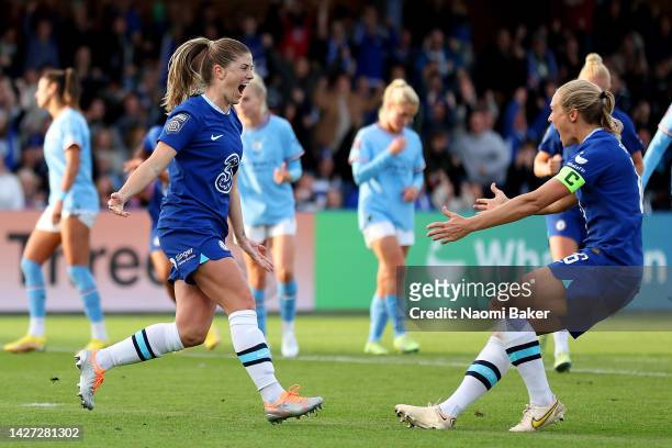 Maren Mjelde of Chelsea celebrates with teammate Magdalena Eriksson after scoring their side's second goal from the penalty spot during the FA...