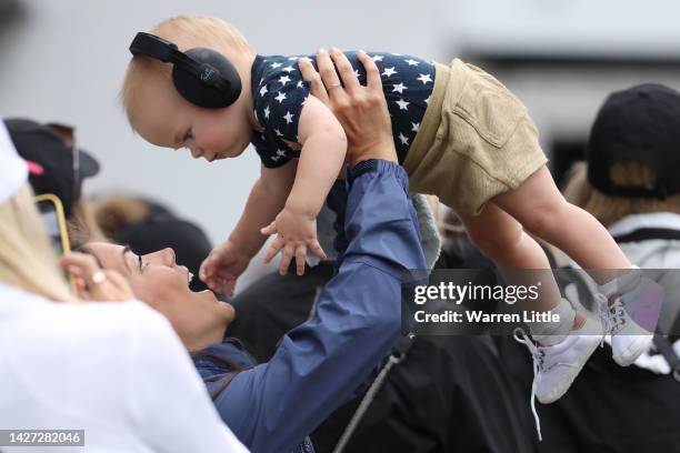 Annie Spieth, wife of Jordan Spieth of the United States Team, holds child Sammy during Sunday singles matches on day four of the 2022 Presidents Cup...