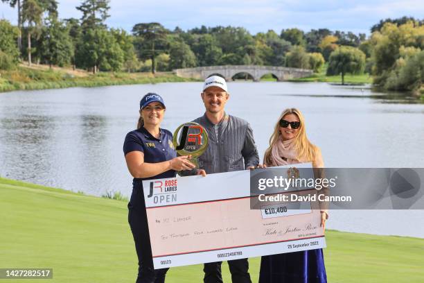 My Leander of Sweden is presented with the Rose Ladies Open trophy and her winners cheque by Justin Rose and Kate Rose after her win during the Rose...