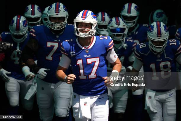 Quarterback Josh Allen of the Buffalo Bills runs onto the field before the game against the Miami Dolphins at Hard Rock Stadium on September 25, 2022...
